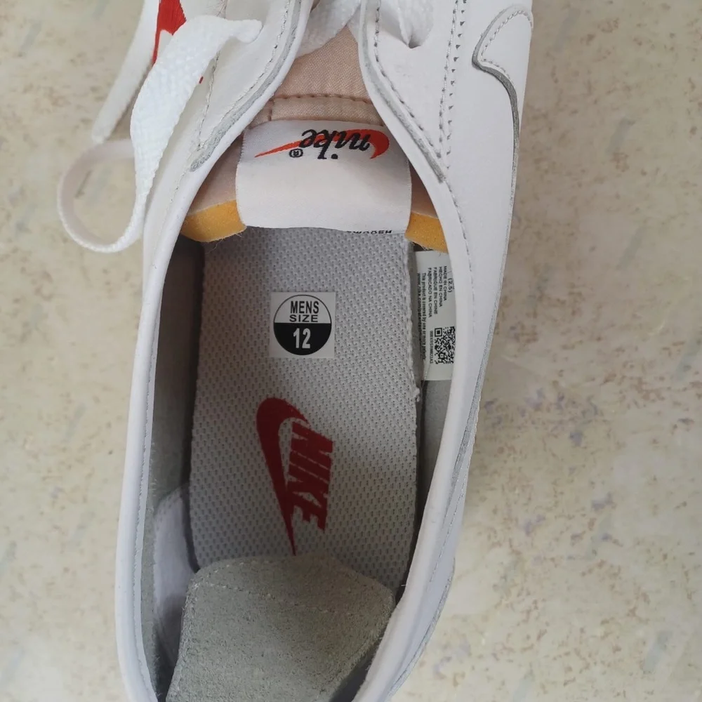 Nike White Sneakers with Red Swoosh and Blue Outsole Trim
